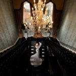 IMG_5062 Photo of married couple standing on the large stairs in Colwick Hall Hotel.