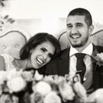 IMG_6578 Black and white photo of recently married couple, sitting on very comfortable chairs.