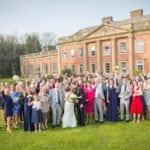 gardens Photo of married couple and all guests in front of the Colwick Hall Hotel.