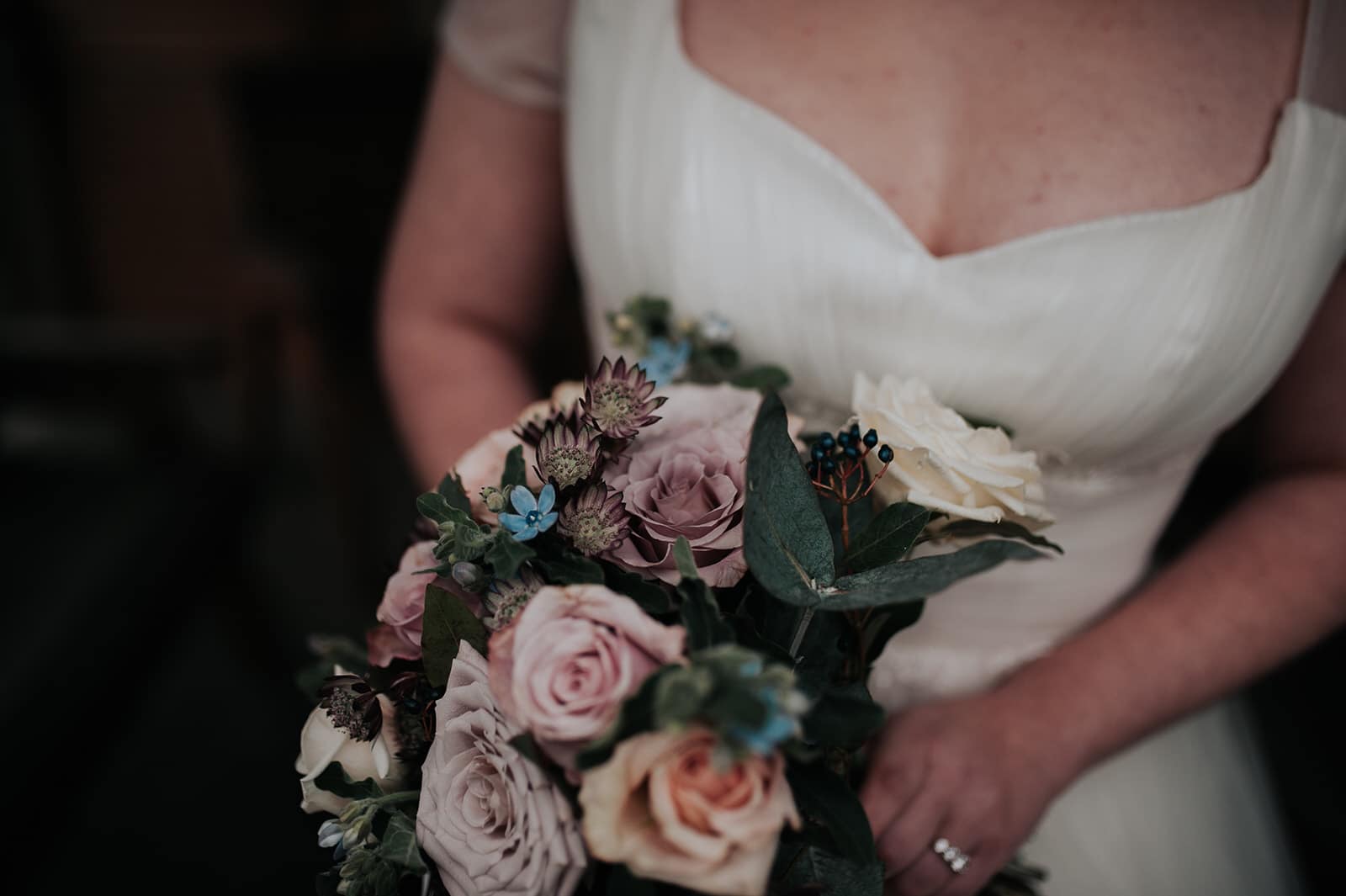 Bride holding bouquet of flowers